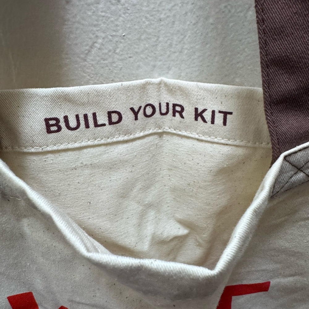 Wiggy Kit Canvas Tote Bag with 'BUILD YOUR KIT' Print - Natural & Red Accents - Picture 2 of 4